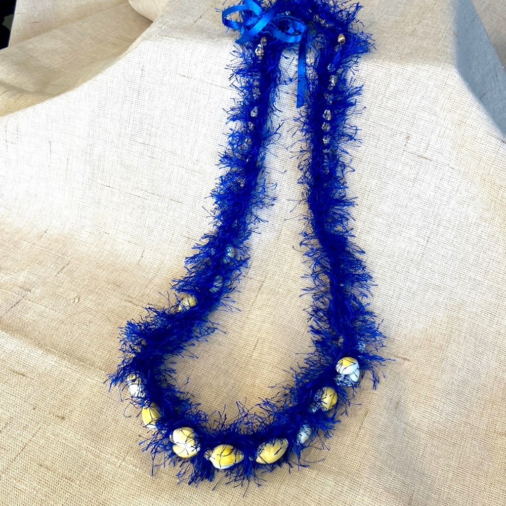 Bundle Up! Made in Borneo one-of-a-kind shell necklace livens up T’s or dress!